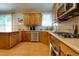 Spacious kitchen with wooden cabinets, stainless steel appliances, and granite countertops at 2015 Towne Lake W Hls, Woodstock, GA 30189