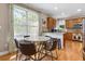 Bright kitchen with a marble dining table and modern countertops at 2015 Towne Lake W Hls, Woodstock, GA 30189
