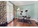 Living room features hardwood floors, large window, and electric drums set at 2015 Towne Lake W Hls, Woodstock, GA 30189
