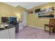 Comfortable home office area featuring a desk, chair, and carpeted floors at 2015 Towne Lake W Hls, Woodstock, GA 30189