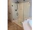 Bathroom featuring a modern glass-enclosed shower with a black rainfall shower head and hardware at 2015 Towne Lake W Hls, Woodstock, GA 30189