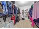 Large walk-in closet featuring ample shelving, hanging rods, and organized storage solutions at 2015 Towne Lake W Hls, Woodstock, GA 30189