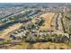 Panoramic aerial view of an expansive golf course community, highlighting meticulously manicured greens and surrounding residential areas at 3313 Alhambra Cir, Hampton, GA 30228