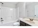 Bathroom featuring a tub and shower combination, toilet and sink with dark wood cabinets at 3313 Alhambra Cir, Hampton, GA 30228
