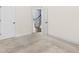 Neutral bedroom with soft carpet and doors leading to other parts of the home at 3313 Alhambra Cir, Hampton, GA 30228
