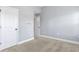 A carpeted bedroom features motivational wall decals and two white doors at 3313 Alhambra Cir, Hampton, GA 30228