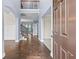 Stunning two-story foyer with hardwood floors and an open staircase offers a grand entrance at 3313 Alhambra Cir, Hampton, GA 30228