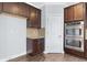 Gourmet kitchen showcases a double oven and plenty of cabinet storage for all your cooking needs at 3313 Alhambra Cir, Hampton, GA 30228