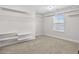 Spacious walk-in closet with carpet, window, and white storage shelving on the walls at 3313 Alhambra Cir, Hampton, GA 30228