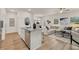 Open-concept living area boasts hardwood floors, neutral paint, modern decor and plenty of natural light at 1017 Merritt Dr # 103, Villa Rica, GA 30180