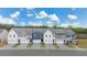 New townhomes featuring multiple garage doors, colorful exteriors and beautifully landscaped front yards at 1017 Merritt Dr # 103, Villa Rica, GA 30180