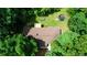 Aerial view of the roof and backyard showing the deck and surrounding lush, mature trees at 1638 River Trce, Auburn, GA 30011