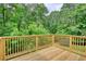 Relaxing wooden deck overlooking wooded backyard at 1638 River Trce, Auburn, GA 30011
