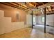 Unfinished basement showing utilities, support beams, and concrete floor, offering potential for customization at 1638 River Trce, Auburn, GA 30011