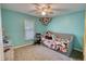 Bedroom with a ceiling fan, a comfortable daybed and a window for plenty of natural light at 1638 River Trce, Auburn, GA 30011