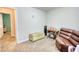 Bedroom with neutral walls featuring a brown leather lounging couch and small desk at 1638 River Trce, Auburn, GA 30011