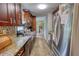 Kitchen featuring stainless steel appliances, granite countertops, and custom backsplash at 1638 River Trce, Auburn, GA 30011