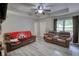 Spacious living room with ceiling fan, plenty of natural light, and durable flooring at 1638 River Trce, Auburn, GA 30011