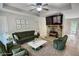 Stylish, virtually staged living room featuring a stone fireplace and elegant modern furniture at 1638 River Trce, Auburn, GA 30011
