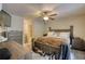 Spacious main bedroom featuring a ceiling fan, carpet, and dresser with flatscreen TV above at 1638 River Trce, Auburn, GA 30011