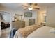 Main bedroom with a bed, dressers, and a ceiling fan, offering a comfortable and relaxing retreat at 1638 River Trce, Auburn, GA 30011