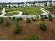 An expansive greenspace features walking paths and lush landscaping, offering a serene setting for outdoor activities at 2002 Freestone Way, Marietta, GA 30064