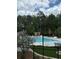 Community pool with poolside gazebo and landscaping, surrounded by lush greenery at 2002 Freestone Way, Marietta, GA 30064