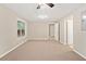 Finished basement with carpet, neutral walls, access to multiple rooms, and natural light at 2605 Woodland Hills Dr, Cumming, GA 30040