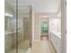 Luxurious bathroom featuring a glass-enclosed shower and a double vanity sink at 2605 Woodland Hills Dr, Cumming, GA 30040