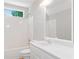 Bright bathroom featuring a vanity with a framed mirror, and a shower-tub combo at 2605 Woodland Hills Dr, Cumming, GA 30040