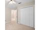 Bedroom featuring neutral carpet, a ceiling fan, and double closets at 2605 Woodland Hills Dr, Cumming, GA 30040
