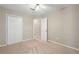 Neutral bedroom with carpet, ceiling fan, and closet, freshly painted at 2605 Woodland Hills Dr, Cumming, GA 30040
