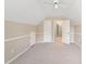 Bonus room features neutral paint and carpet, and access to two closets at 2605 Woodland Hills Dr, Cumming, GA 30040