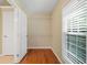 Spacious walk-in closet with ventilated shelving and hardwood flooring at 2605 Woodland Hills Dr, Cumming, GA 30040
