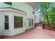 Spacious outdoor deck area featuring stained wood and an outdoor view surrounded by nature at 2605 Woodland Hills Dr, Cumming, GA 30040