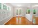 Bright dining area with hardwood floors, large windows and access to outdoor deck at 2605 Woodland Hills Dr, Cumming, GA 30040