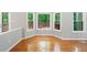 Charming dining area with large windows offering views of the outdoor deck at 2605 Woodland Hills Dr, Cumming, GA 30040