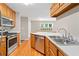 Well-equipped kitchen featuring stainless steel appliances and hardwood floors at 2605 Woodland Hills Dr, Cumming, GA 30040
