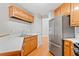 The kitchen offers stainless steel appliances and ample counter space at 2605 Woodland Hills Dr, Cumming, GA 30040
