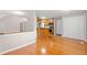 Bright living room with hardwood floors adjacent to a kitchen with stainless steel appliances at 2605 Woodland Hills Dr, Cumming, GA 30040
