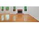 Open living area featuring hardwood flooring, fireplace, and natural light at 2605 Woodland Hills Dr, Cumming, GA 30040