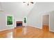Spacious living area with hardwood floors, a fireplace, and ample natural light at 2605 Woodland Hills Dr, Cumming, GA 30040