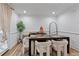 Bright and modern dining area with neutral colors, wooden table, and stylish chairs at 3147 Buford Ne Hwy # 8, Brookhaven, GA 30329