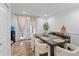 Elegant dining area with French doors, modern furnishings, and ample natural light at 3147 Buford Ne Hwy # 8, Brookhaven, GA 30329