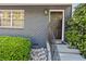 Inviting front entrance with a dark door and manicured green bushes, creating a welcoming ambiance at 3147 Buford Ne Hwy # 8, Brookhaven, GA 30329