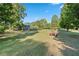 Expansive green lawn with picnic tables, ideal for outdoor activities and gatherings at 3147 Buford Ne Hwy # 8, Brookhaven, GA 30329