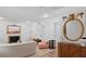 Open-concept living room with fireplace, modern decor, and a decorative gold mirror at 3147 Buford Ne Hwy # 8, Brookhaven, GA 30329