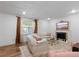 Bright and airy living room with comfortable seating, stylish fireplace, and elegant curtains at 3147 Buford Ne Hwy # 8, Brookhaven, GA 30329
