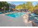Sparkling pool surrounded by lounge chairs, offering a refreshing oasis for relaxation and enjoyment at 3147 Buford Ne Hwy # 8, Brookhaven, GA 30329