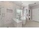 Modern bathroom with a large glass shower, soaking tub, and tiled accent wall at 4298 Kingston Gate Cv, Chamblee, GA 30341